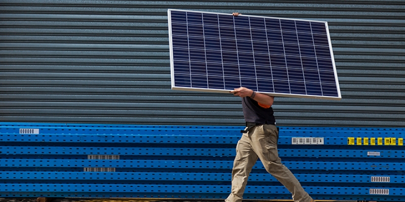 Solar panel being installed by electrician