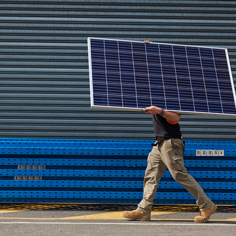 Solar panel being installed by electrician